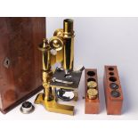 A brass microscope by E Leitz WEtzlar No.38714 Filiale New York. RetailerÕs mark C Baker 244 High