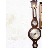 A Georgian mahogany wheel barometer. H96cm