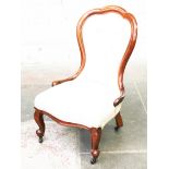 A Victorain walnut spoon back chair. H94cm