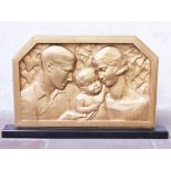 An Art Deco plaster relief plaque inscribed Delabassee and Sevin on a black marble base. L98cm