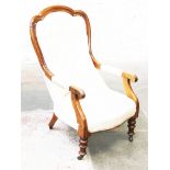 A Victorian walnut armchair. H102cm