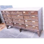 A large bank of pine drawers. W193cm D50cm H108cm