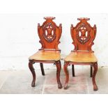 A pair of mahogany hall chairs. H90cm