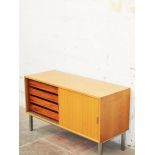 A teak sideboard on chromed legs in the style of Merrow Ascociates. W122cm D48cm H71cm