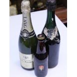 A bottle of Lang Biemont champagne, a bottle of Bollinger champagne and a bottle of Greenall Whitley