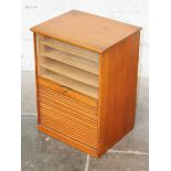 An oak tambour front cabinet. H51cm