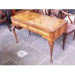 A walnut two drawer side table. L124cm