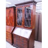 A Georgian mahogany bureau bookcase. H227cm