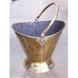 An Art Nouveau style brass coal bucket