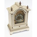 A cream and gold painted ting tang mantel clock. H42cm