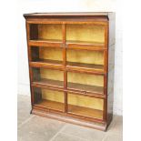 An oak sectional bookcase. W128cm D36cm H162cm