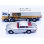 A Corgi 007 Aston Martin DB5 (passenger and torpedos missing) together with a Dinky Supertoys