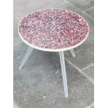 A retro three leg plastic table. H44cm