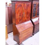 A Georgian mahogany bureau bookcase. H219cm