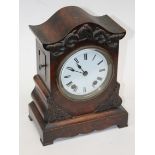 A walnut mantel clock. H31cm