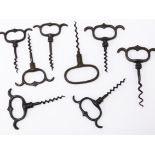 A group of eight corkscrews comprising seven four finger straight pull corkscrews and one Cellar