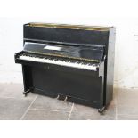 A Chappell black ebonised piano of small proportion. L132cm