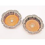 A pair of silver plated wine coasters. Diam. 19cm. Condition - no damage nor any repairs, general