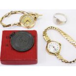 A mixed lot comprising two 9ct gold wristwatches, a life saving medal and a silver ring