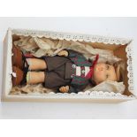 A Goebel boy doll. L27cm. Condition - doesn't appear to have ever been out of the box.