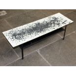 A vintage coffee table decorated in the manner of Jackson Pollock. L114cm