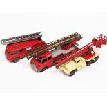 Three Dinky Supertoys vehicles comprisng two fire engines and a crane. Condition - generally play