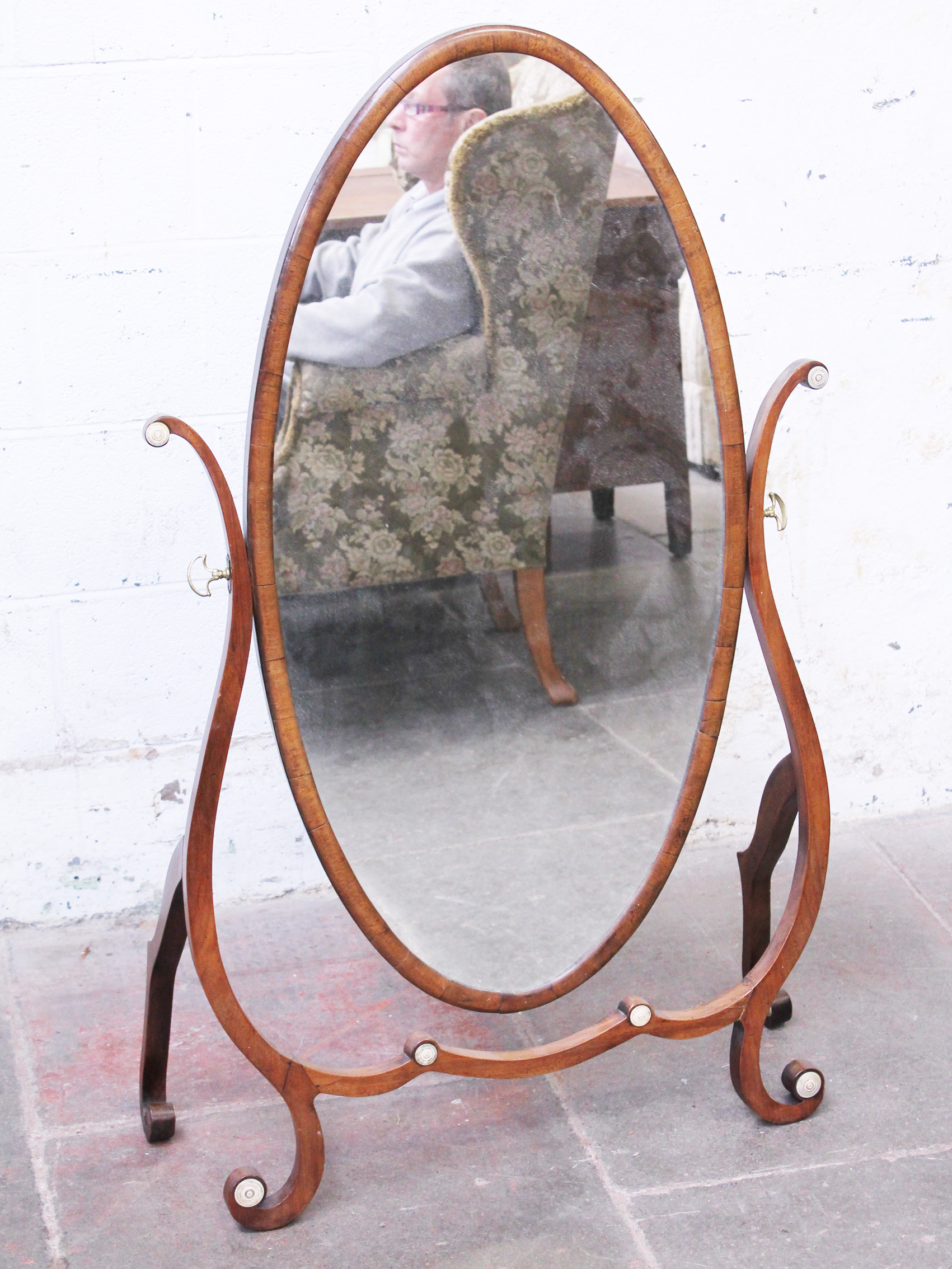 A 19th Century oval cheval mirror with ivory roundels. H127cm