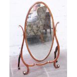 A 19th Century oval cheval mirror with ivory roundels. H127cm