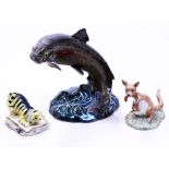 A group of three ornaments comprising a Beswick Trout no 1032 and two Royal Doulton Winnie The