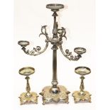 A Victorian silver plated centre piece and a pair of matching candle stands. H21cm and 60cm.