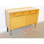 A Gordon Russell light oak sideboard circa 1950s. Labelled "Russell of Broadway". L137cm D46cm