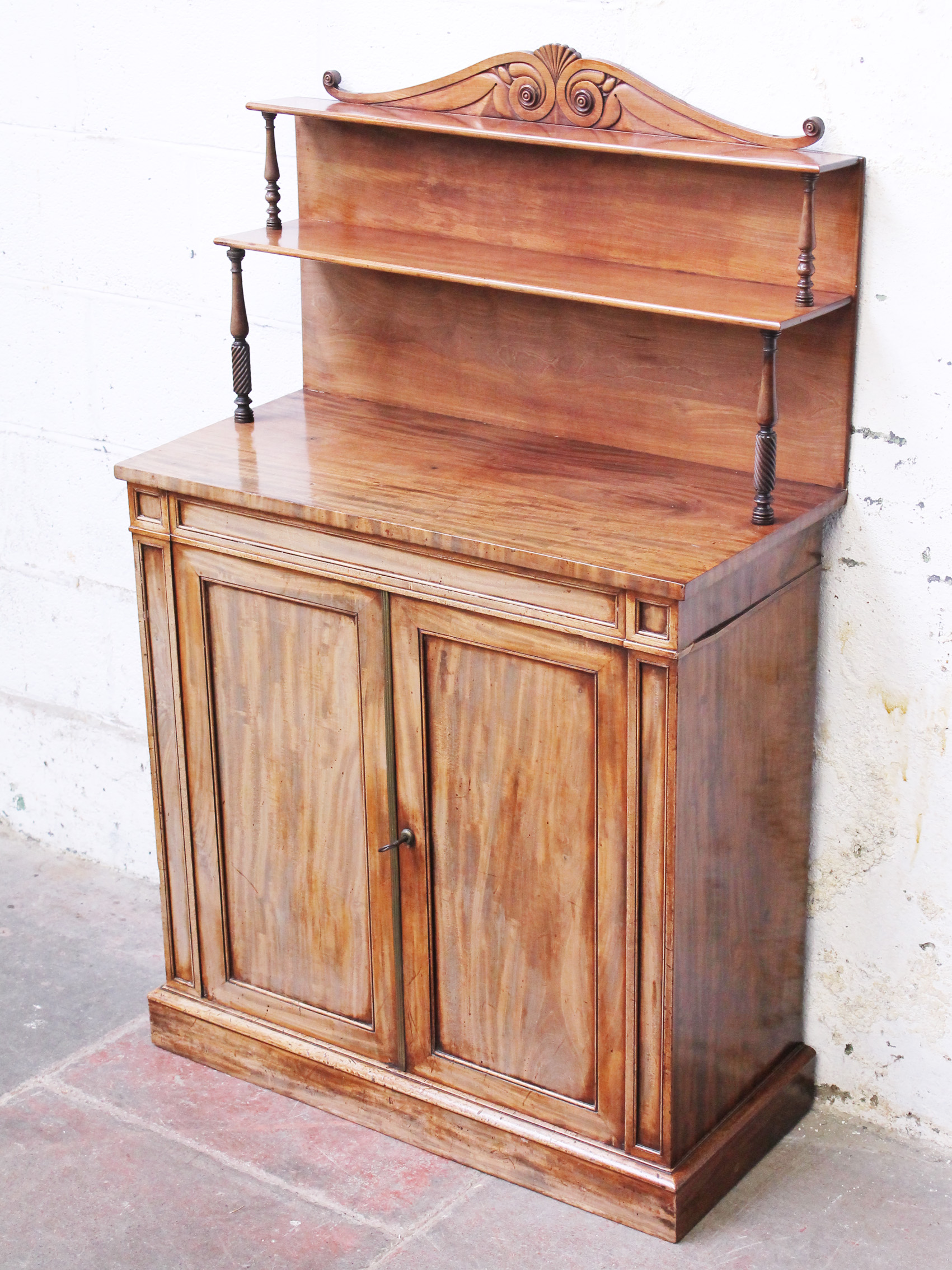 A Regency mahogany chiffonier having two tier superstructure with turned suports. W81cm D39cm