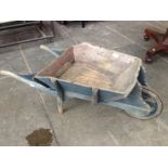 An antique miniature wheel barrow. L94cm