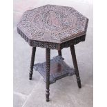 A profusely carved eastern table. H62cm