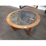 A G-Plan round glass top teak coffee table. Diam. 84cm H46cm