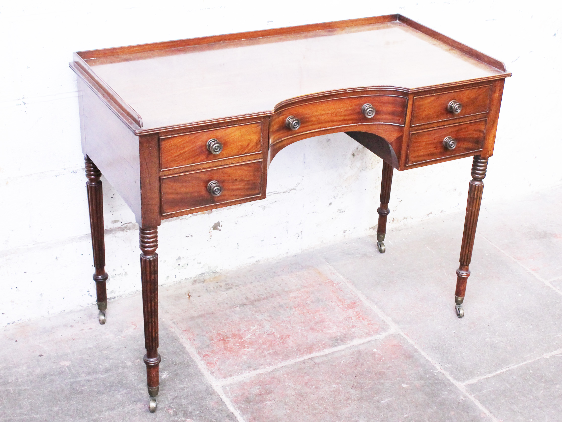 A Regency mahogany side table. W108cm D52cm H80cm
 
Old and newer surface scratches to top.  There