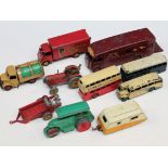 A group of eight Dinky Toys comprising two tractors, three buses, horse box, Golden Shred van and