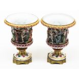 A pair of Naples porcelain urns on gilt metal stands. H14cm. Condition - very good, no damage nor