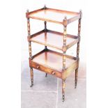 A Regency mahogany three tier whatnot with lower drawer. W57cm D38cm H113cm