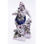 An 18th Century Bow porcelain figure of a woman holding a flower. H24cm. Condition - right arm has