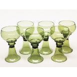A set of six early 20th Century green glass goblets in the manner of James Powell & Sons. H16.5cm.