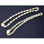 Two ivory bead necklaces. Early 20th Century. L62cm each