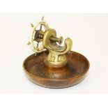 A nut cracker in the form of a ships wheel. Diam.14cm. Condition - no damage, general wear only to