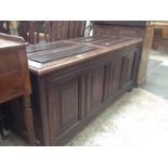 A panelled oak coffer. L182cm