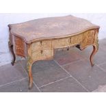 A Louis XV style continental marquetry inlaid and gilt metal mounted double sided writing desk circa