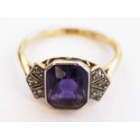 An 18ct gold Art Deco diamond and amethyst ring. Gross wt. 3.4g. Size M