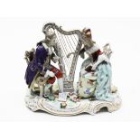 A Naples porcelain figure group. L20cm. Condition - damage/repair to back of gent's chair,