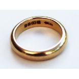 A 22ct gold wedding band. Wt. 6.2g. Size I