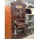 A Victorian carved oak hall stand. H220cm