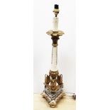 An early 20th Century lamp with ivory feet. H76cm. Condtion - good, general wear to include minor